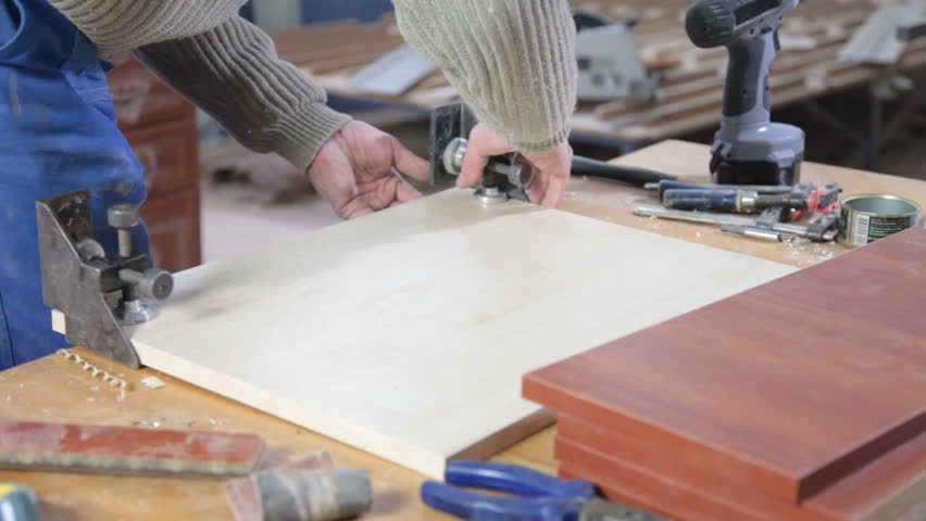 Furniture maker at work in workshop
