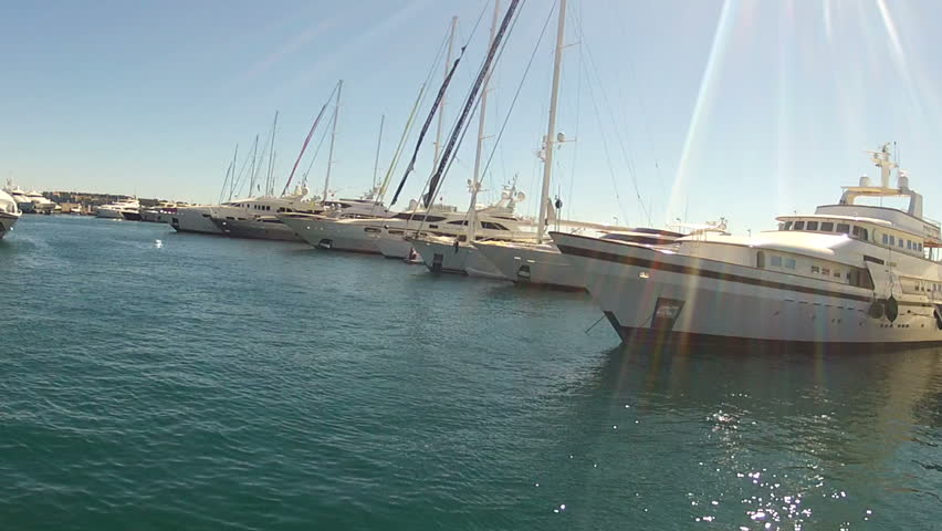 Passing Luxury Super Yachts in the harbour at Cannes, France. Purpose tilt on camera. GoPro HERO2