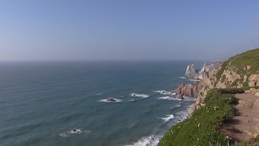 Cape Cabo da Roca at Atlantic coast, Portugal - pan Lighthouse complex on the edge of the Cape at the westernmost mainland coast of Portugal and continental Europe