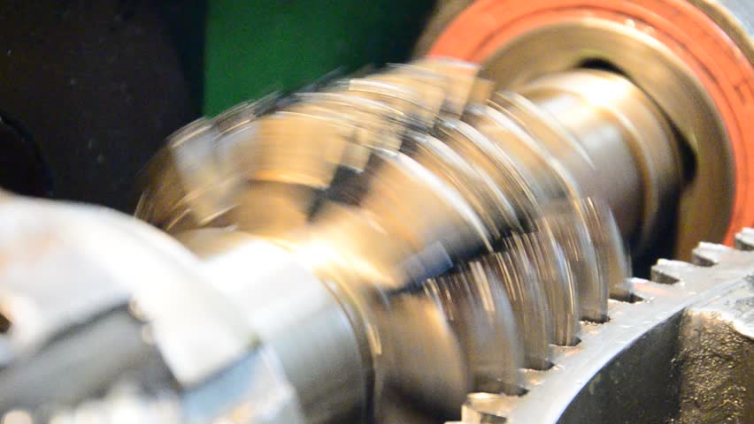 wormwhee gear, cogwheel production and service industrial machine, rotating gears extreme closeup view