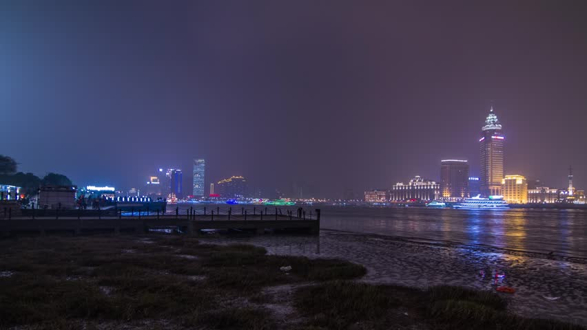 SHANGHAI - CIRCA 2013: Time Lapse of River Boat Traffic night view by Pudong with flying lantern in Shanghai, China