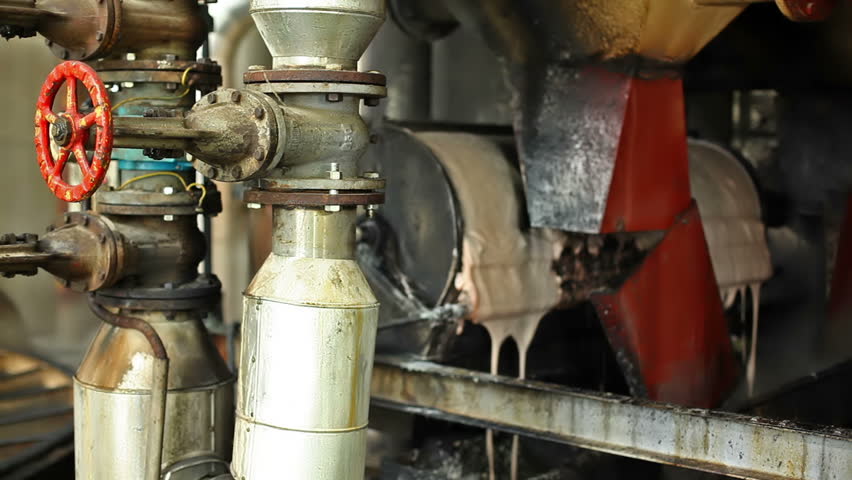 Steam in industrial plants, inside the factory for sugar production. Processing Sugar Beet in Sugar Refinery.