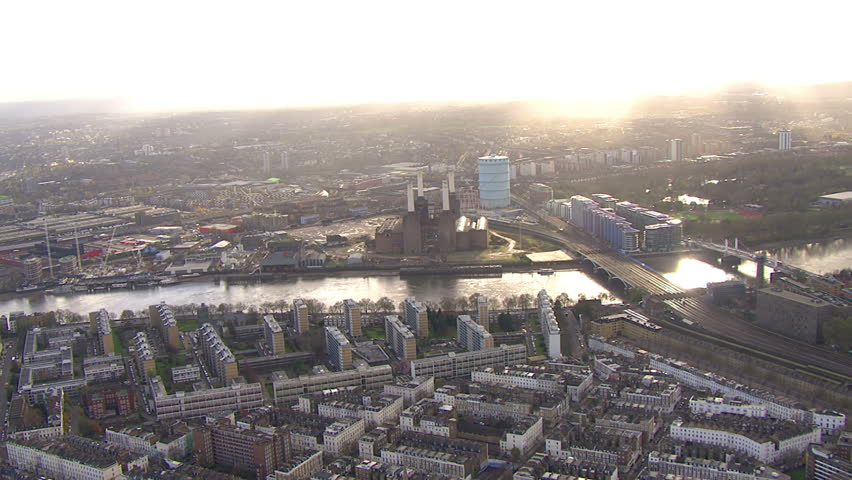Aerial view over a section of the river thames in London, England on a bright autumn morning