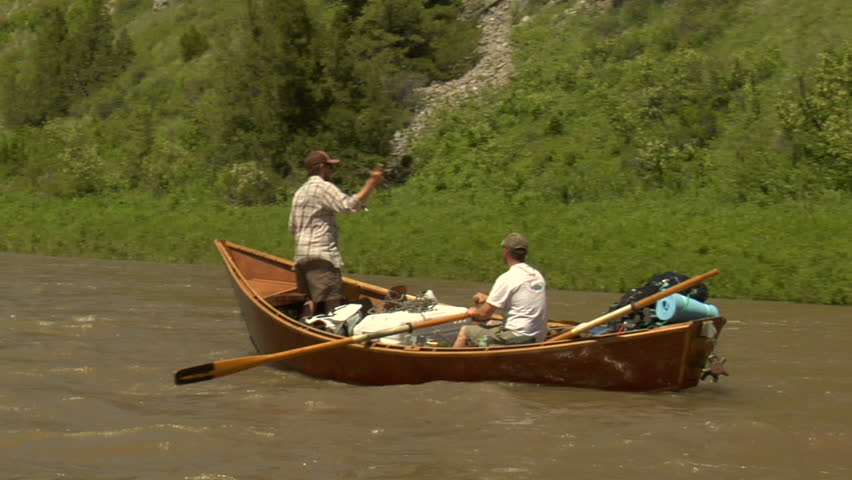 Driftboat in River with mountains