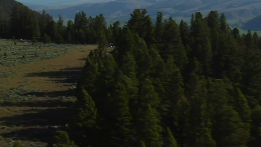 aerial shot of sagebrush pastureland with mountains