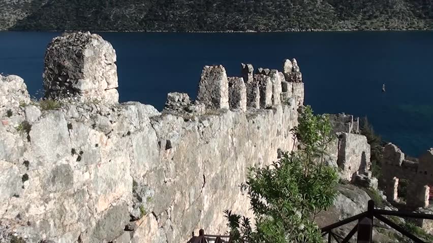 SIMENA, Turkey â March 17, 2013: Fortress wall and sea view