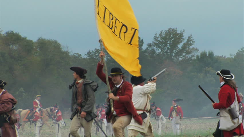 VIRGINIA - OCTOBER 2009 - large-scale, epic American Revolutionary War anniversary reenactment -- in the middle of battle.  Continental Army Militia retreats and runs away from British in battle