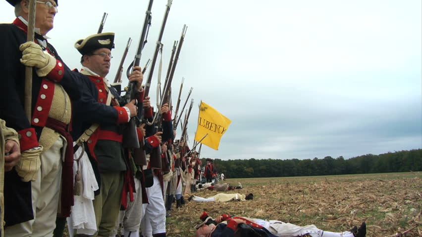 VIRGINIA - OCTOBER 2009 - large-scale, epic American Revolutionary War anniversary reenactment -- in the middle of battle.   Continental Army infantry volleys and fires in line of battle - Militia.