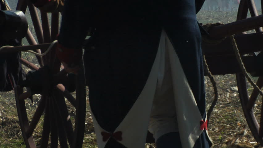 VIRGINIA - OCTOBER 2009 - large-scale, epic American Revolutionary War anniversary reenactment -- in the middle of battle.  Continental Army (or British) cannon crew loads and fires iron cannon