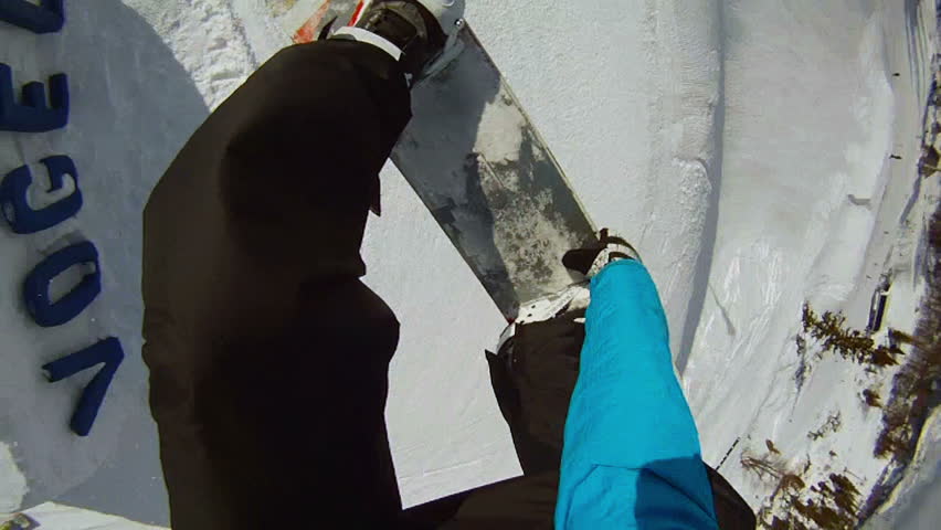 FIRST PERSON VIEW: snowboarder jumps frontside 360