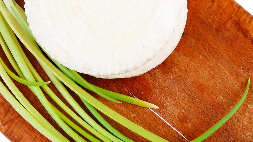 dairy products : feta white cheese on cut board isolated over white background
