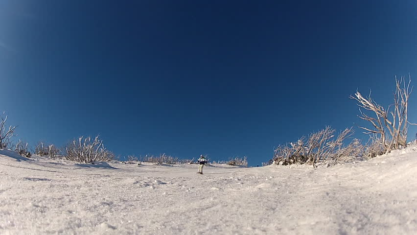 Snowboarder Spraying Camera With Snow