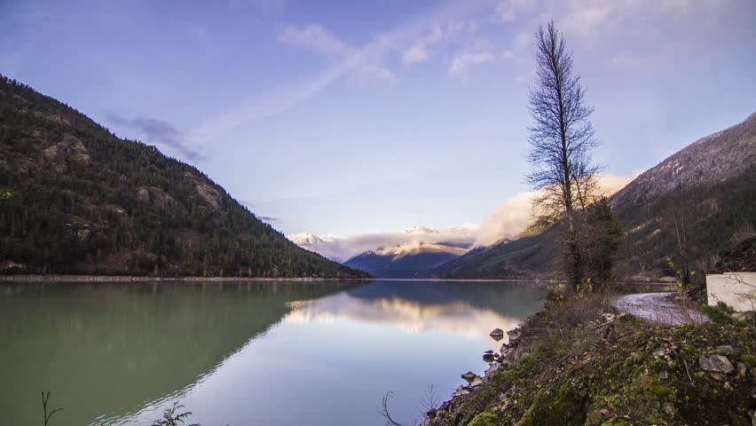 Sunset Light Reflection  on Mountain by Lillooet Lake, BC, Canada. Photo Sequence shot in RAW and Post-Production in After Effects