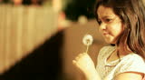 Dandelion little girl innocence Child Blowing a freedom spring childhood summer