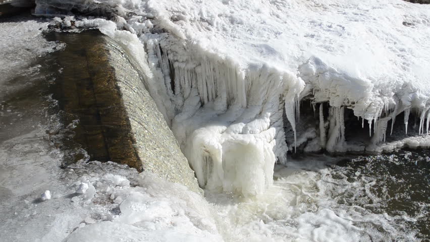 corner of river waterfall water cascade fall down and splash bubble. beautifully frozen ice and icicles.