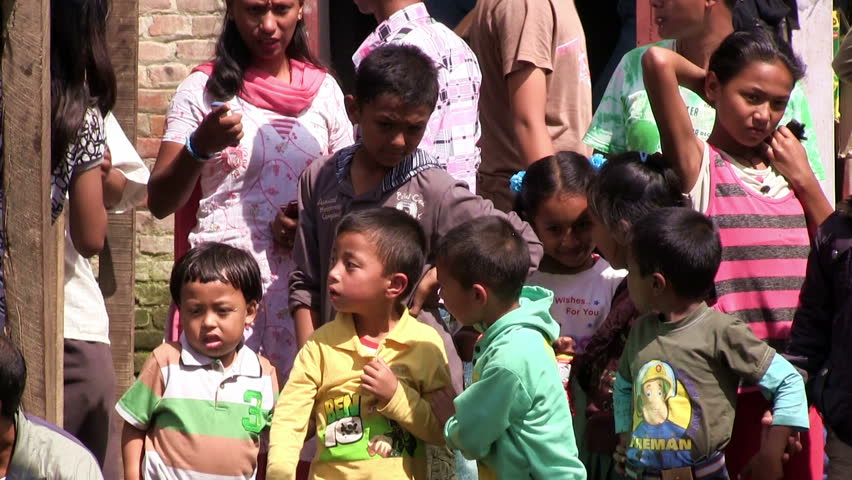 BUNGAMATI REGION, NEPAL â CIRCA OCTOBER 2011 â Nepali children and tibetan refugees waiting during Bhairab festival circa October 2011 in Bungamati in Nepal. 