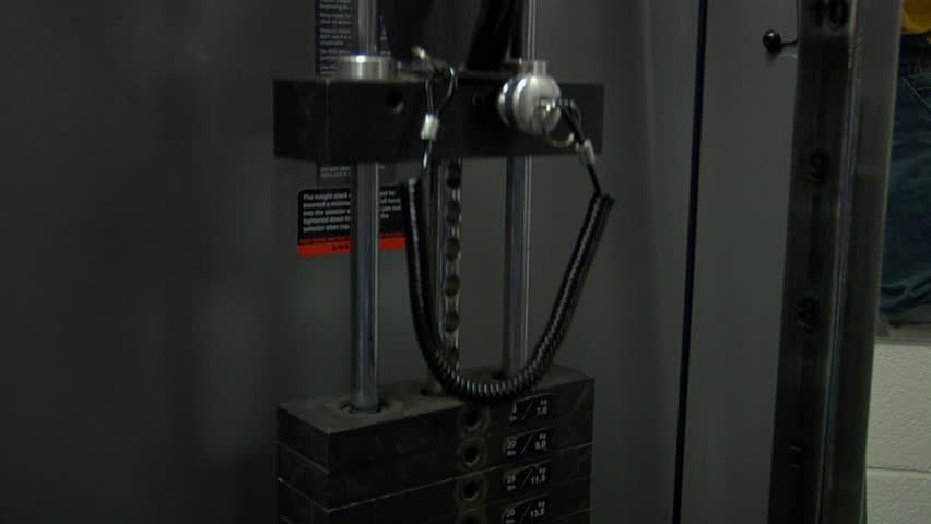 Gym weights being lifted