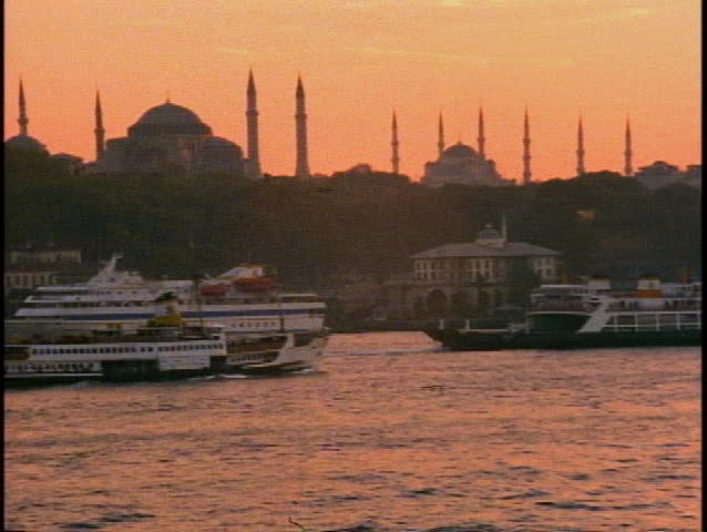 Istanbul, overview shot with mosques, minarets, harbor, and ferries at sunset