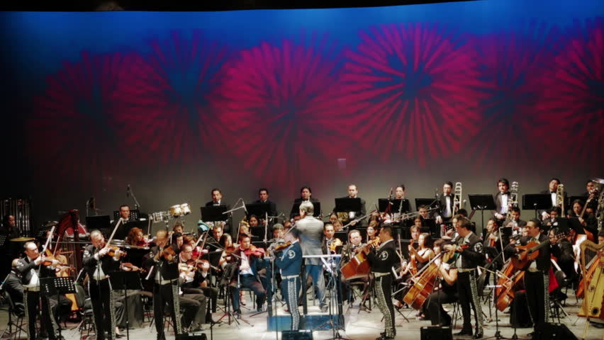 GUANAJUATO, MEXICO - CIRCA OCTOBER 2012: Playing together in concert mariachi and symphonic orchestra at Cervantino Culture Festival