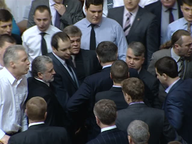 KIEV - MARCH 18: Fight on parliament floor between Nationalists and Communists in Kiev, Ukraine on March 18, 2013.