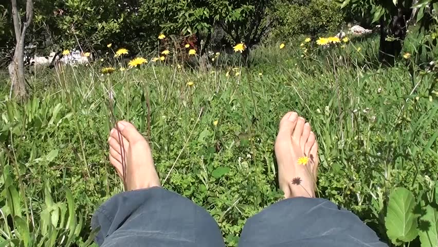 Resting in grass barefooted