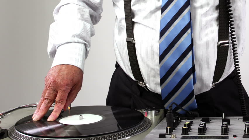 a very funky elderly grandpa dj mixing records
