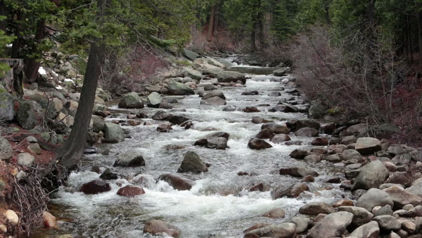 Sierra Nevada California mountain river. Beautiful Sierra Nevada mountain river flowing into the Sacramento valley.  Sierra Nevada mountain range in the U.S. states of California and Nevada.