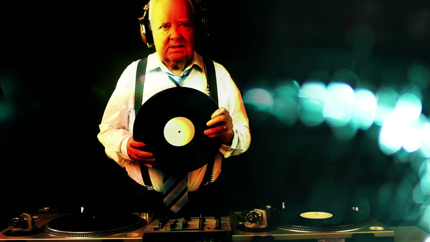 a very funky elderly grandpa dj mixing records
