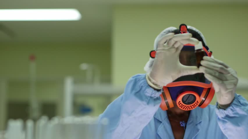 Medicine, hazardous jobs and science, and pharmaceutical laboratory with scientist wearing mask and looking at camera while working. Sequence