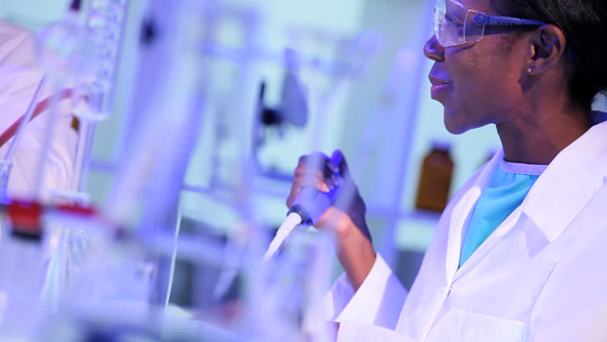 Ethnic female lab technician close up working in laboratory