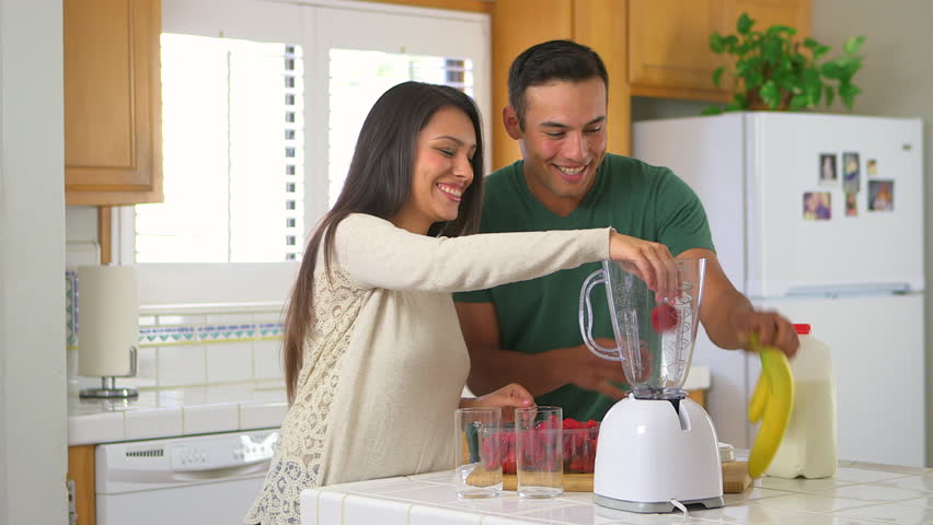 Mexican couple making smoothies