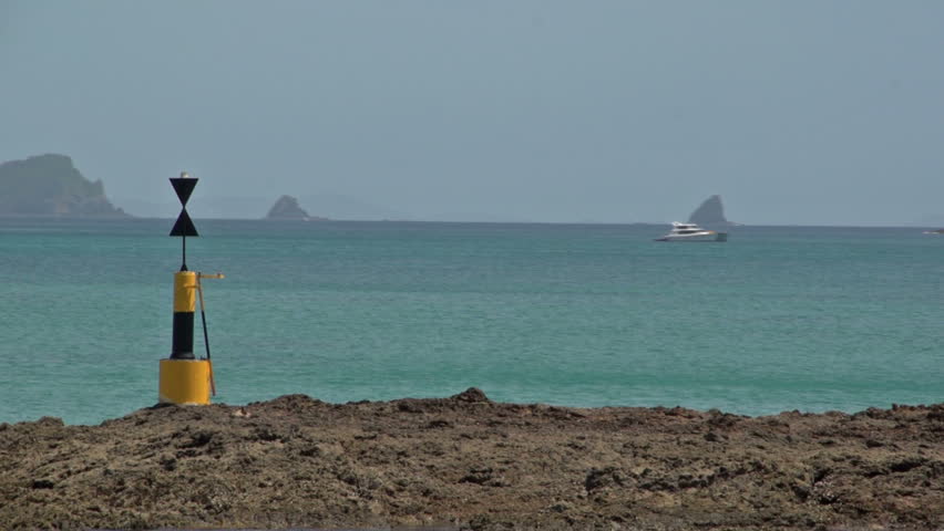 New Zealand. March 2013. A cardinal mark indicates one of the four compass directions, This cardinal mark Indicates that the deepest and safe water to pass on is the west side of the mark 



