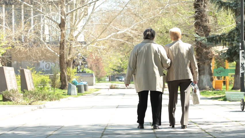 Senior women walking along the alley