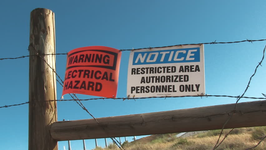 Warning and Restricted signs on Barbed Wire