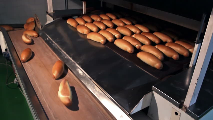 Golden baked bread ; warm baked bread at the exit of the oven,video clip