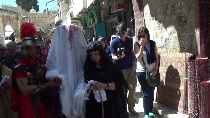 JERUSALEM-MARCH 29: Catholic Holy Friday - a group of actors depicting the crucifixion of Christ near Holy Sepulcher in Old City Jerusalem, Holy Friday March 29, 2013 in Jerusalem, Israel