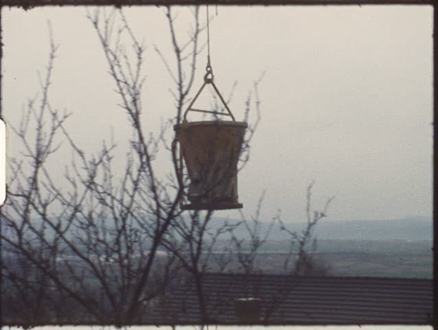 Vintage 8mm film: Housebuilding, Transporting concrete with crane