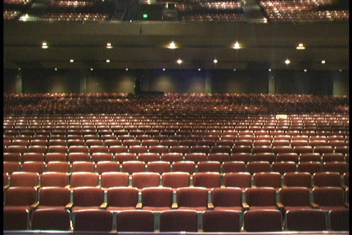Upward pan from seats to spotlights