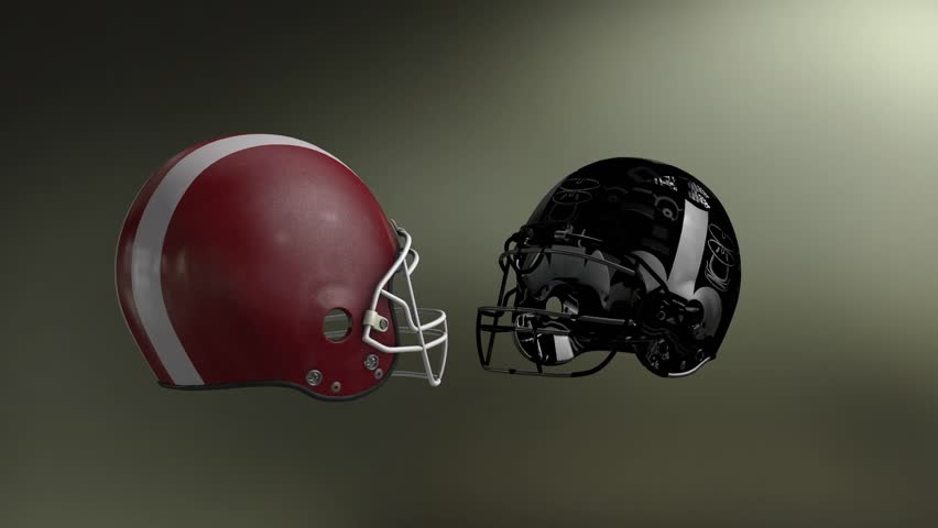 two football helmets collide