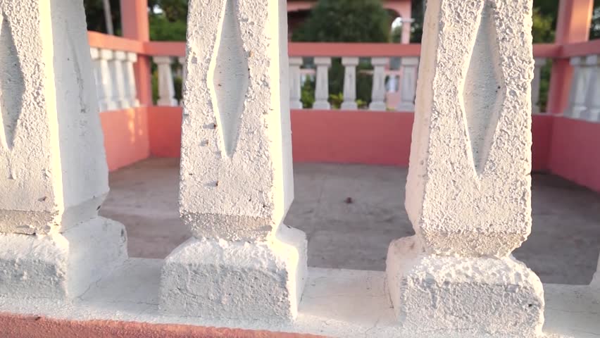 Panning across gazebo stone pillars.