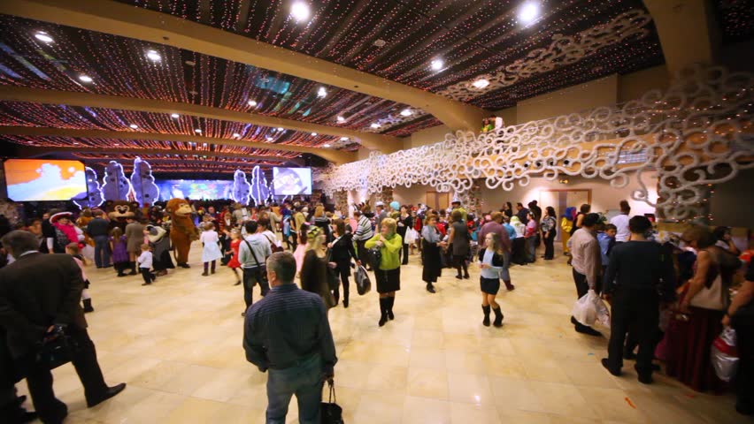 MOSCOW - JAN 04: ( rotating camera) Parents and kids moving in main hall at Forum hall Moscow masquerade of Moscow families, on Jan 04, 2012 in Moscow, Russia.
