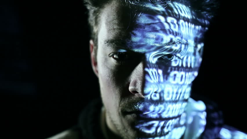 ID theft looking at the camera with binary codes reflections
