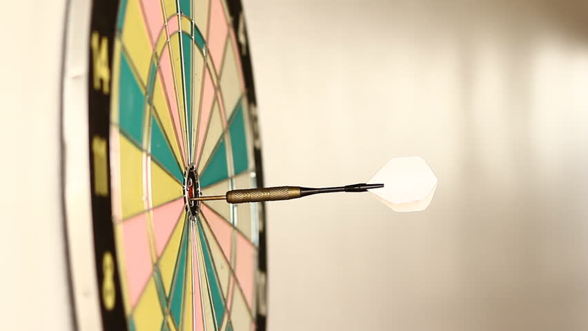 Hurling darts at the target.