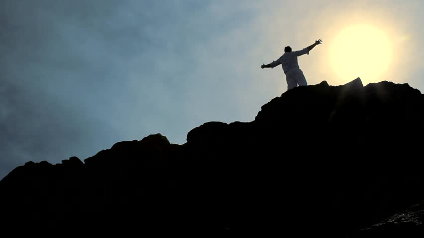 Christ Like Pose of a Man at the Top of a Hill Background HD