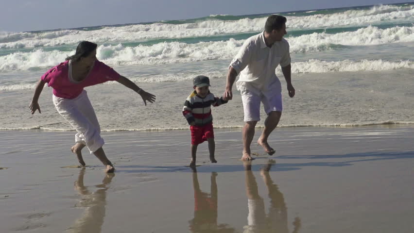 Happy family having fun on the beach
