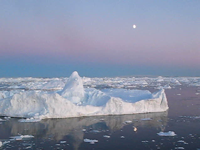 Drifting through a mystic Antarctic icescape at moonlight