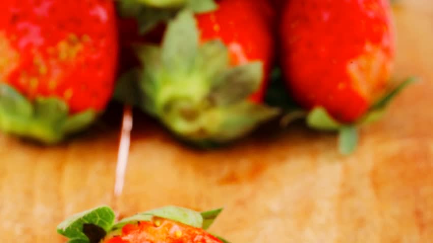 raw fruits: fresh ripe strawberry over wooden plate 1920x1080 intro motion slow hidef hd
