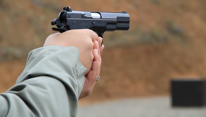 close-up of a pistol being fired