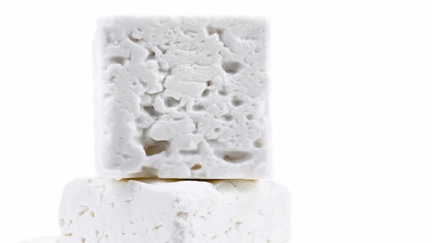 dairy product : fresh raw white soft greek feta cheese cubes and round on wooden plate 1920x1080 intro motion slow hidef hd
