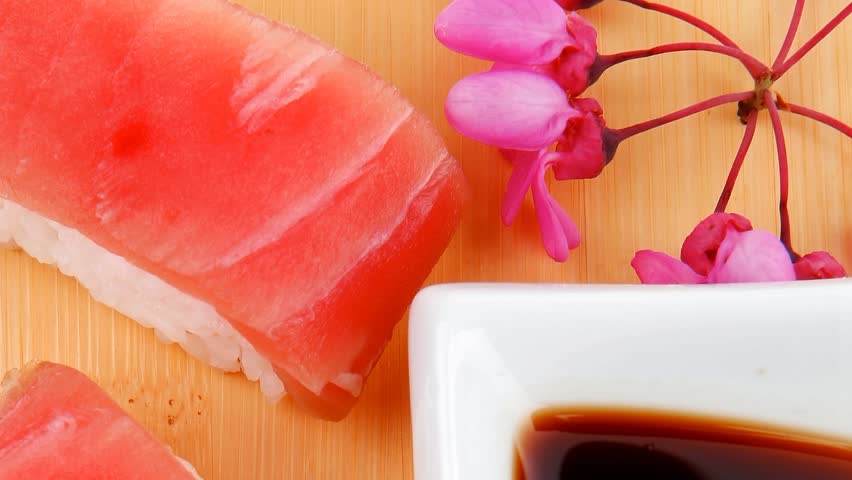 Nigiri Sushi - Set of Nigiri sushi topped with raw Tuna (maguro) . . on wooden board 1920x1080 intro motion slow hidef hd